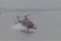Helicopter skid hits the water with amazing consequences