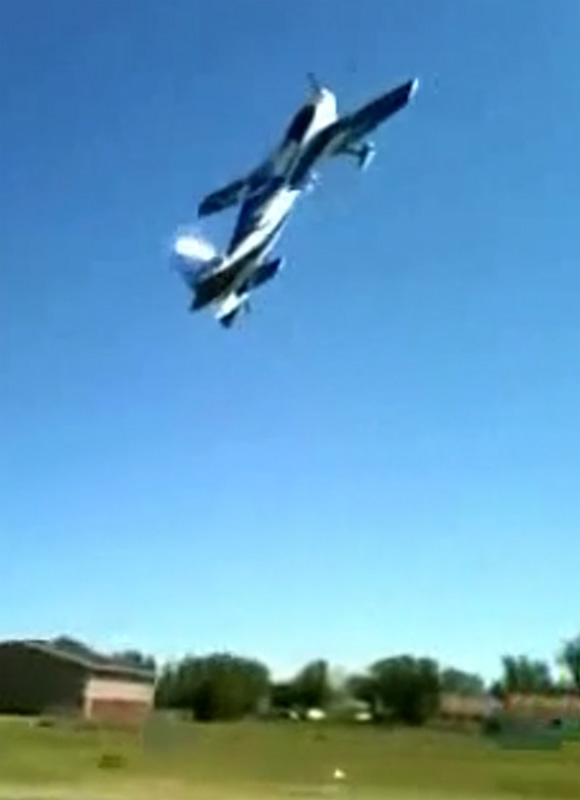 Midair collision between a biplane and a large-scale radio-controlled model