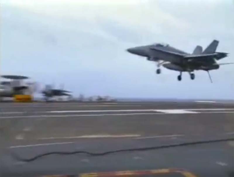 The F18 hornet lands on a carrier, but the arresting cable snaps