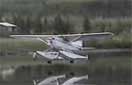 Landing of a seaplane on water... gear down. Amazing outcome