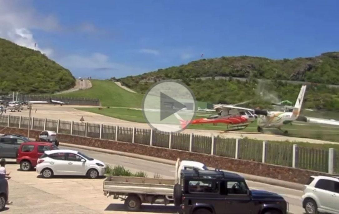The Air Antilles Express DHC-6 veers off the runway on landing and collides with a helicopter